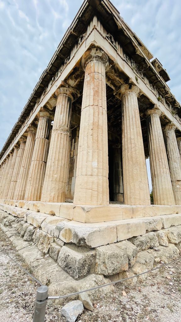 Low angle of the ancient Temple of Hephaestus in Athens, showcasing classical Greek architecture.